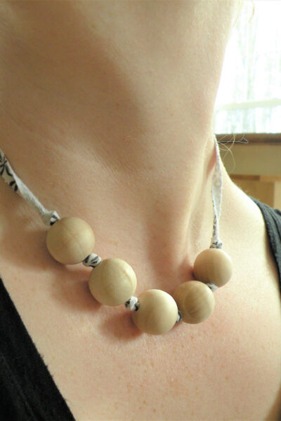 DIY Wooden Bead Oil Diffuser Necklace on ladies neck